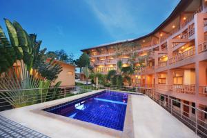 a view of the courtyard of a hotel with a swimming pool at Haad Yao Bayview Resort & Spa - SHA plus Certified in Haad Yao