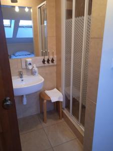 a bathroom with a sink and a mirror at Lawendowe Siedlisko in Zator +14 photos