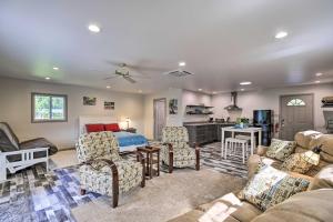 a large living room with a bed and a living room at Riverfront Elizabethton Detached Studio with Grill in Elizabethton