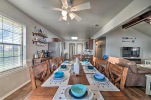 a dining room with a table and a ceiling fan at Lakefront Home Less Than 3 Miles to Historic Granbury! in Granbury