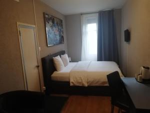 Postel nebo postele na pokoji v ubytování Hotel Parc & Lac