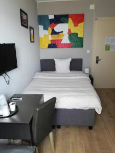 Postel nebo postele na pokoji v ubytování Hotel Parc & Lac