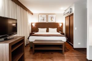 Llit o llits en una habitació de Bourbon Ponta Grossa Convention Hotel