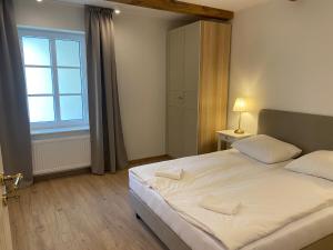 Ένα ή περισσότερα κρεβάτια σε δωμάτιο στο Apartamenty Rynek23