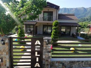a house with a gate in front of it at Aelia Studios in Skala Potamias