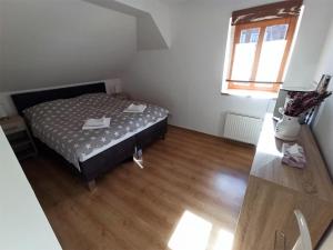Postelja oz. postelje v sobi nastanitve Apartmany U Lva