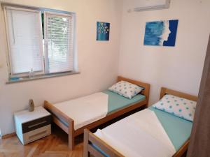 Posteľ alebo postele v izbe v ubytovaní Studio apartman Promona