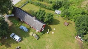 an overhead view of a house with cars parked in a field at Swedish Idyll in Årstad