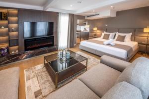 a hotel room with two beds and a fireplace at Valente Suites&Hotel in Istanbul