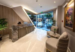 a lobby with two chairs and a reception desk at Valente Suites&Hotel in Istanbul