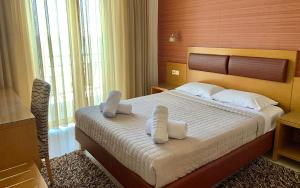 
Ένα ή περισσότερα κρεβάτια σε δωμάτιο στο Hotel Flisvos
