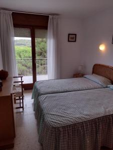 Posteľ alebo postele v izbe v ubytovaní Apartamento con terraza en la playa de La Fosca