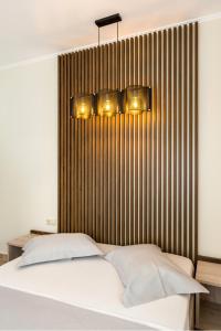 A bed or beds in a room at Villa 4 you iliopetra