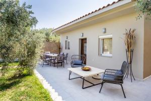 A patio or other outdoor area at Villa 4 you iliopetra