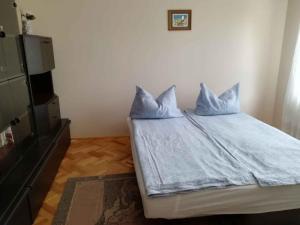 מיטה או מיטות בחדר ב-Apartment Keszthely 3