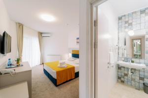 Koupelna v ubytování NOVUS Hotel