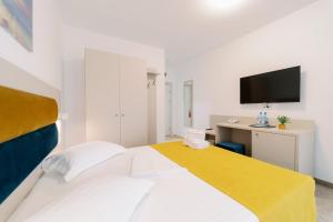 Postel nebo postele na pokoji v ubytování NOVUS Hotel