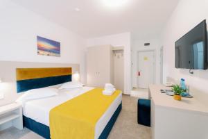 Postel nebo postele na pokoji v ubytování NOVUS Hotel