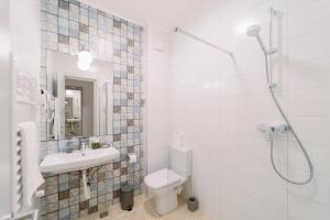 Koupelna v ubytování NOVUS Hotel