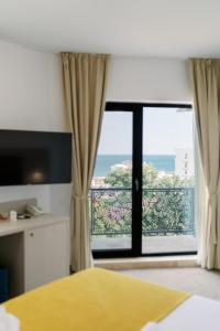 Postel nebo postele na pokoji v ubytování NOVUS Hotel