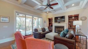 a living room with a couch and a fireplace at 5 Rum Row in Hilton Head Island