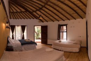 Кровать или кровати в номере Lodge Atacama Horse