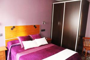 Postel nebo postele na pokoji v ubytování Hostal Extremeño