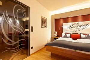 Postel nebo postele na pokoji v ubytování Hotel Weinbauer