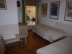 Ein Bett oder Betten in einem Zimmer der Unterkunft Affittacamere Locanda la Posta