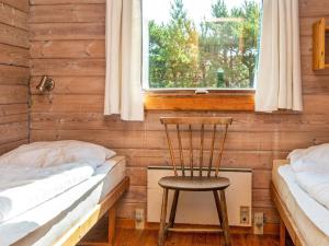 En eller flere senge i et værelse på 6 person holiday home in Rømø-By Traum