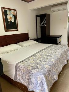 Кровать или кровати в номере Apartotel Flamboyant
