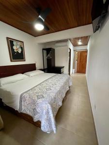 Кровать или кровати в номере Apartotel Flamboyant