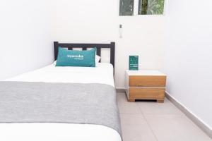 Posteľ alebo postele v izbe v ubytovaní Ayenda Casa Prado 59