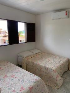 Una cama o camas en una habitación de Casa de Praia - Francês/Marechal Deodoro