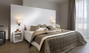 Postel nebo postele na pokoji v ubytování Hotel Biancamano