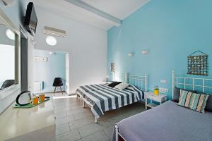 Postel nebo postele na pokoji v ubytování Afrodete Hotel + 37 fotografií
