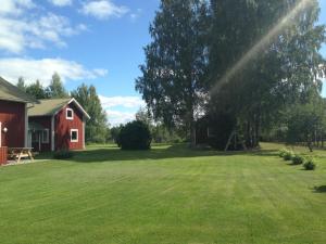 Zahrada ubytování Hansjö Stugby - Mickolavägen + 6 fotografií