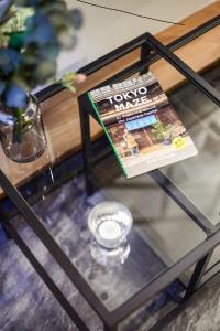 
a glass bottle of water sitting on top of a table at ALT STAY Azabudai - Vacation STAY 31654v in Tokyo
