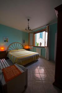 a bedroom with two beds and a window at In Tracastello - parking - in Riomaggiore