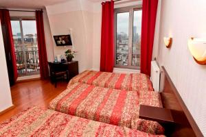 Postel nebo postele na pokoji v ubytování Hipotel Paris Printania Maraichers