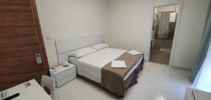 A bed or beds in a room at B&B IONIO