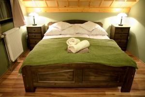 Ein Bett oder Betten in einem Zimmer der Unterkunft Patkószeg Vendégház