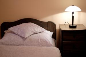 Ein Bett oder Betten in einem Zimmer der Unterkunft Patkószeg Vendégház
