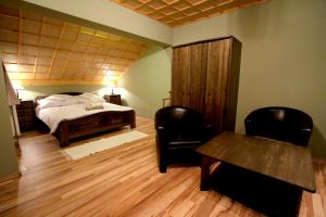 Ein Bett oder Betten in einem Zimmer der Unterkunft Patkószeg Vendégház