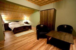 Ein Bett oder Betten in einem Zimmer der Unterkunft Patkószeg Vendégház