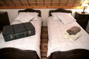 Ein Bett oder Betten in einem Zimmer der Unterkunft Patkószeg Vendégház