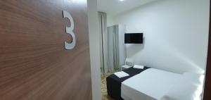 A bed or beds in a room at B&B IONIO