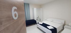 A bed or beds in a room at B&B IONIO