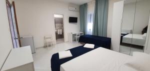 A bed or beds in a room at B&B IONIO