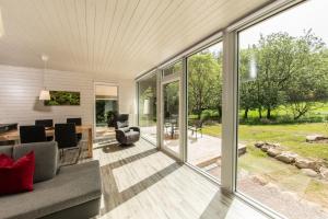 an open living room with sliding glass doors at Ferienhaus Lichtung in Ruhla